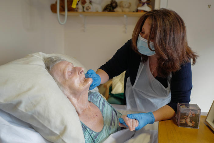 Della Lilley visits with her mother, 89-year old Betty Whiteman at a nursing home during the COVID-19 pandemic.