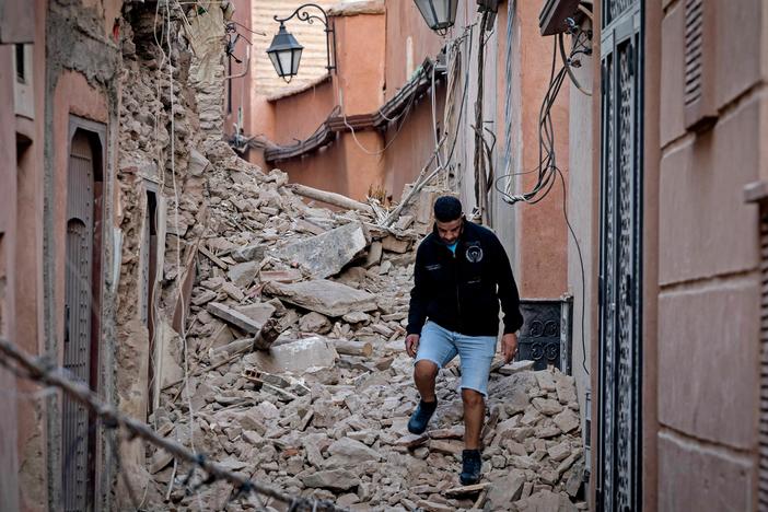 A resident navigates through the rubble on Saturday following a 6.8-magnitude quake in Marrakesh, Morocco.