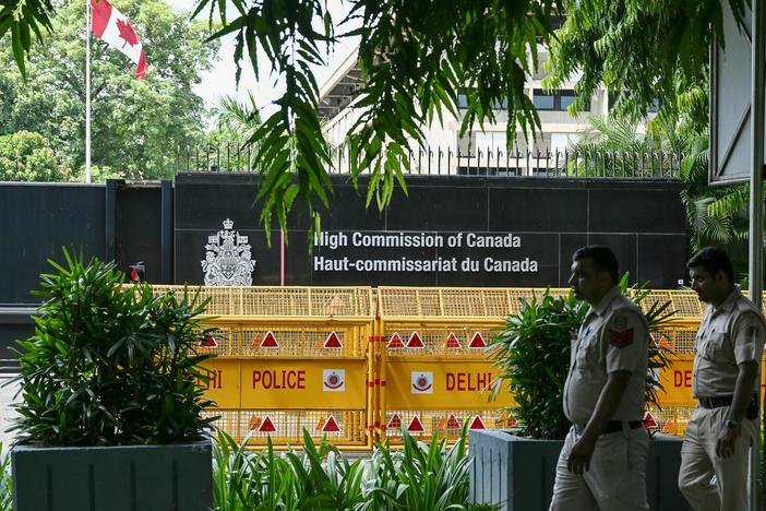 Security personnel outside the High Commission of Canada in New Delhi. Both India and Canada have expelled a diplomat as part of escalating tensions over the death of a Sikh activist in British Columbia in June.