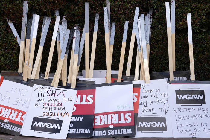 Placards are gathered together at the close of a picket by members of The Writers Guild of America outside Walt Disney Studios, Tuesday, May 2, 2023, in Burbank, Calif.