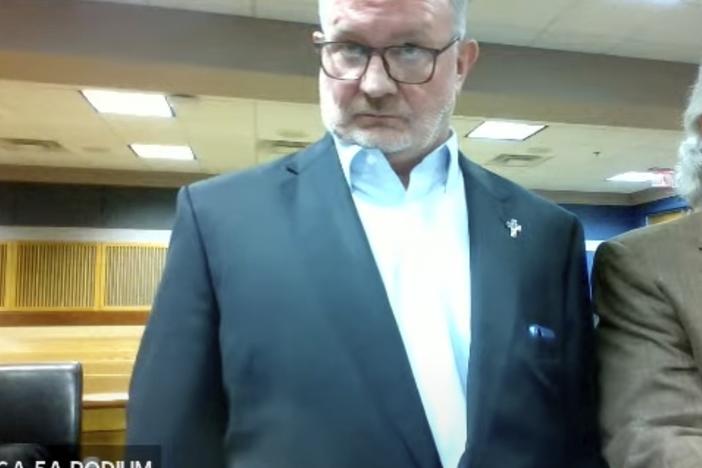 In this image made from video from Judge Scott McAfee's virtual Zoom hearing, Scott Graham Hall, left, stands with his attorney Jeff Weiner, right, in Superior Court of Fulton County before Judge McAfee on Friday, Sept. 29, 2023, in Atlanta.