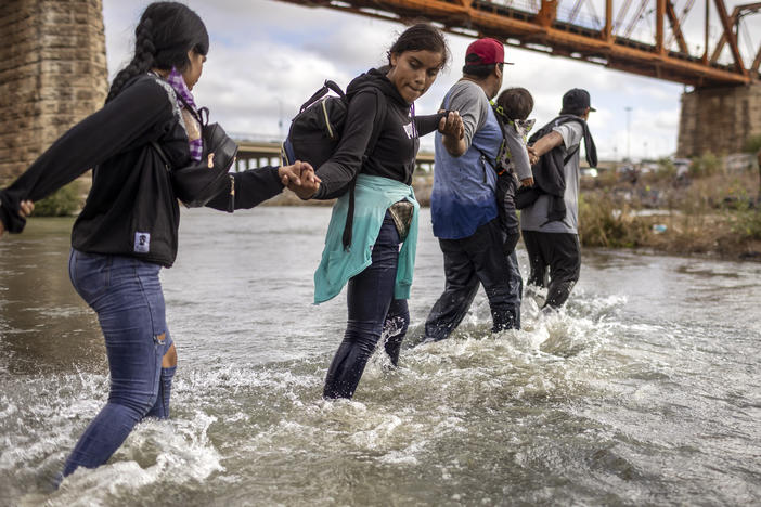 Immigrants from Venezuela crossed the Rio Grande from Mexico into the U.S. last month in Eagle Pass, Texas.
