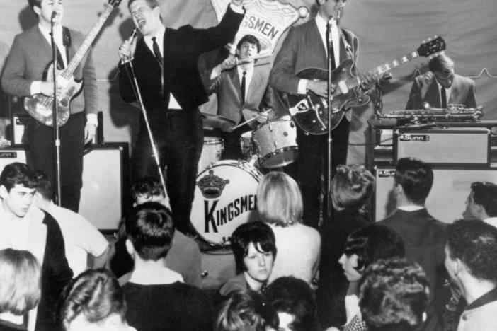 Left to right: Norm Sundholm, Lynn Easton, Dick Peterson, Mike Mitchell, and Barry Curtis of the touring version of the rock and roll band "The Kingsmen" perform onstage in 1964.