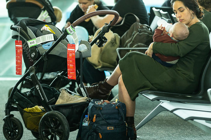 A mother with her baby in the transit zone of terminal A at Brussels Airport, in Zaventem, on November 4, 2022.