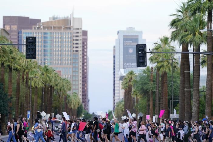 Protesters marched in Phoenix, Ariz., when the U.S. Supreme Court overturned Roe vs. Wade in 2022. This week, the state Supreme Court will determine which of two abortion bans will be enforced in Ariz.