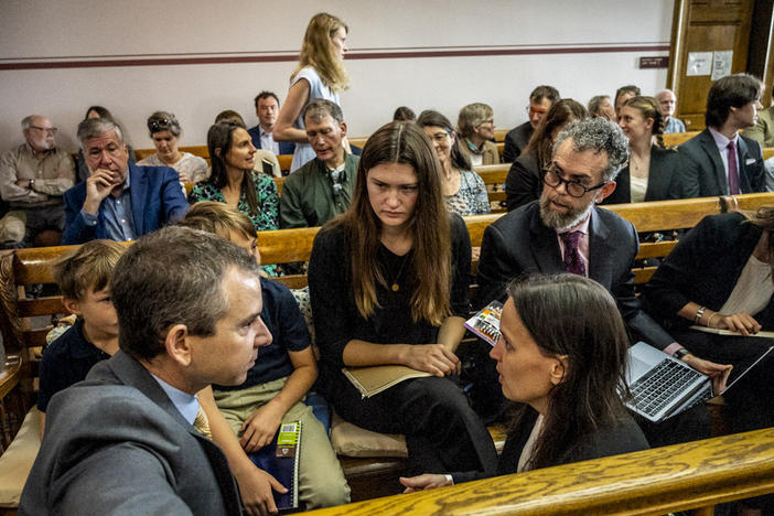 Lead claimant Rikki Held, 22, confers with members of Our Children's Trust legal team before the start of the nation's first youth climate change trial at Montana's First Judicial District Court on June 12, 2023 in Helena, Montana.