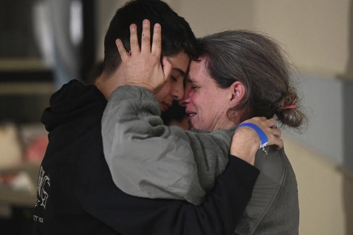Sharon Hertzman, right, hugs her son, Omer Avigdori, as they reunite at Sheba Medical Center in Ramat Gan, Israel, in November. Hertzman and her daughter, Noam Avigdori, were kidnapped by Hamas on Oct. 7 and released last month.