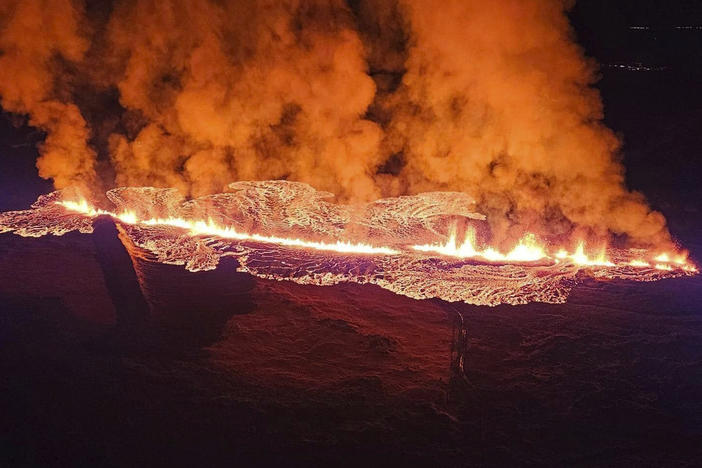 In this photo provided by Civil Protection taken from the Coast Guard's helicopter, a view of lava as the volcano erupts near Grindavík, Iceland, on Sunday.