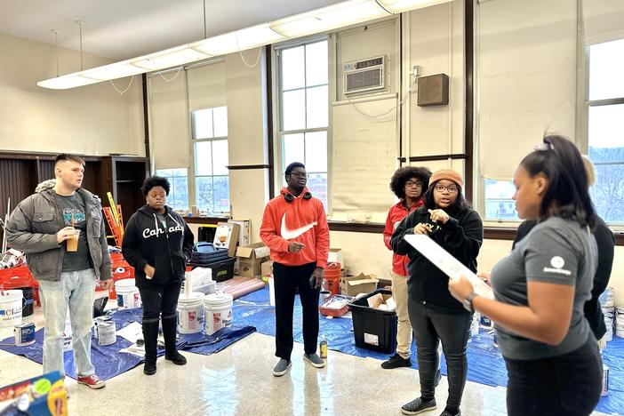 Members of AmeriCorps, a federal volunteerism agency, gather at Herzl Elementary School on Chicago's West Side for a beautification project. It was postponed because of inclement weather.