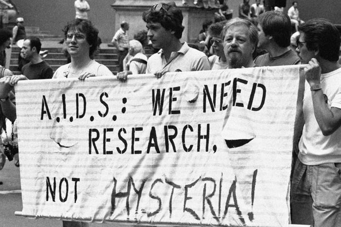 A group advocating AIDS research marches down Fifth Avenue during the Lesbian and Gay Pride parade in New York, June 26, 1983.