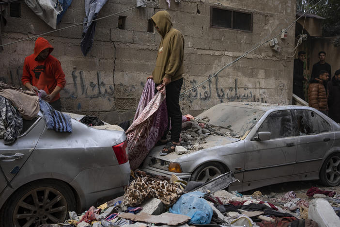 Palestinians survey the destruction from an Israeli airstrike in Rafah, Gaza, on Friday, Feb. 9.