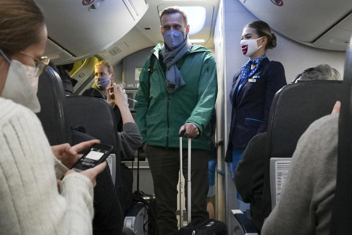 Alexei Navalny and his wife Yulia board the plane prior to flight to Moscow in the Berlin Brandenburg Airport in Schoenefeld, near Berlin, on Jan. 17, 2021.