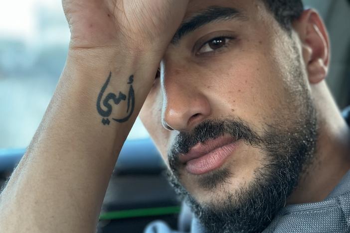 Ibrahim Hassouna, 30, a Gaza social media influencer known as Kazanova, has the phrase "my mom" tattooed on his wrist in Arabic. Most of his family was killed in a Feb. 12 Israeli military operation to rescue hostages.