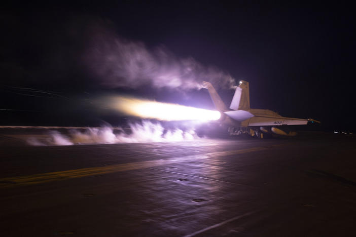 This image provided by the U.S. Navy shows an aircraft launching from USS Dwight D. Eisenhower in the Red Sea last month. The U.S. and Britain struck more than a dozen Houthi targets in Yemen on Saturday, military officials said.