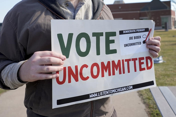 Eric Suter-Bull holds a Vote Uncommitted sign outside a voting location for the Michigan primary election in Dearborn, Mich., on Feb. 27.