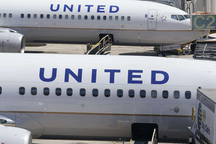 Two United Airlines Boeing 737s are parked at the gate at the Fort Lauderdale-Hollywood International Airport in Fort Lauderdale, Fla., on July 7, 2022.