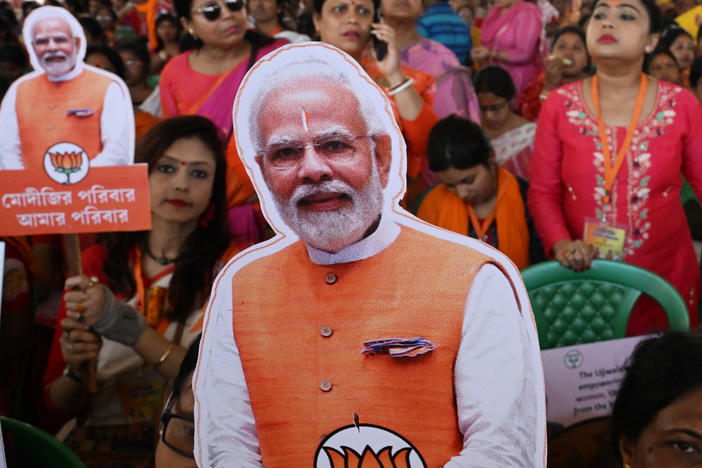 Bhartiya Janata Party (BJP) supporters hold cutout pictures of Indian Prime Minister Narendra Modi during a public meeting in Barasat on the outskirts of Kolkata on March 6. In India, Modi's face is everywhere as the country heads to elections.