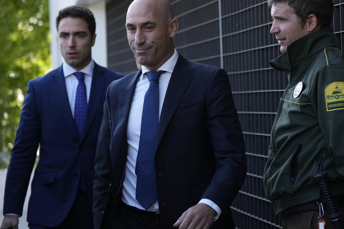 The former president of Spain's soccer federation Luis Rubiales (center) will stand trial for sexual assault charges after forcibly kissing soccer star Jenni Hermoso, a Spanish judge confirmed.