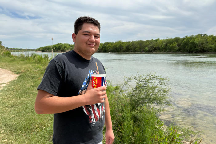 Rashaan Soto, 19, poses in front of a section of the Rio Grande in Eagle Pass, Texas on April 6,. 2024.