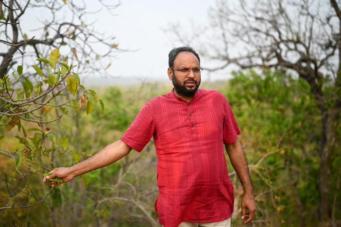 Alok Shukla walks across the Paturiyadand forest of Korba district in India's state of Chhattisgarh. Shukla has led a decade-long grassroots campaign against some of companies seeking to develop coal mines in forested areas.