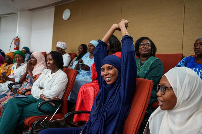 Gambian activist Jaha Dukureh celebrates after the country's parliament rejected the bill to end a ban on female genital mutilation.