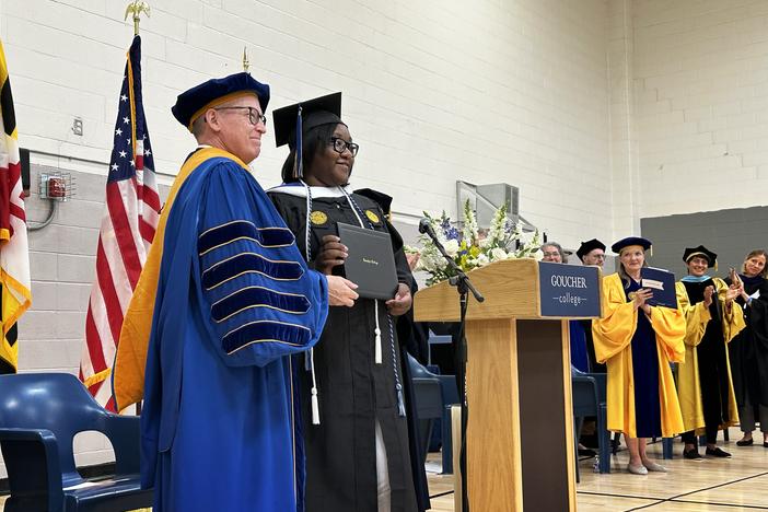 Janet Johnson receives her college diploma from Kent Devereaux, president of Goucher College.