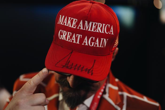 Blake Marnell, delegate from California, shows us his Make America Great Again hat signed by Donald Trump on the third day of the Republican National Convention.