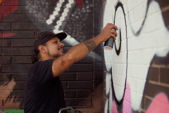 Victor "Marka27" Quiñonez is among the first group of artists to be commissioned as part of Boston's <em>Un-Monument</em> initiative. The artist is seen here working on his large-scale public artwork "<em>Souledad</em>," located in Boston's South End. <br>    
