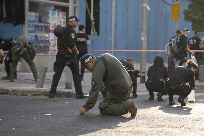 Israeli police investigate the scene of a drone attack in Tel Aviv, Israel on Friday. Yemen's Houthi militia claimed responsibility for the blast that left one dead and several injured.  