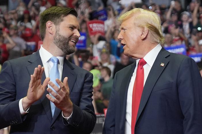 Former President Donald Trump and Republican vice presidential candidate Sen. J.D. Vance, R-Ohio, arrive a campaign rally on Saturday in Grand Rapids, Mich. 