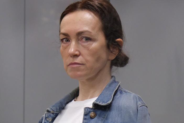 Alsu Kurmasheva, an editor for the U.S. government-funded Radio Free Europe/Radio Liberty's Tatar-Bashkir service, attends a court hearing in Kazan, Russia, in May. A Russian court has convicted Kurmasheva of spreading false information about the Russian army and sentenced her to 6½ years in prison after a secret trial, court records and officials said on Monday. 