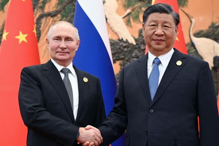 Russian President Vladimir Putin and Chinese President Xi Jinping shake hands during a meeting in Beijing on Oct. 18, 2023. 