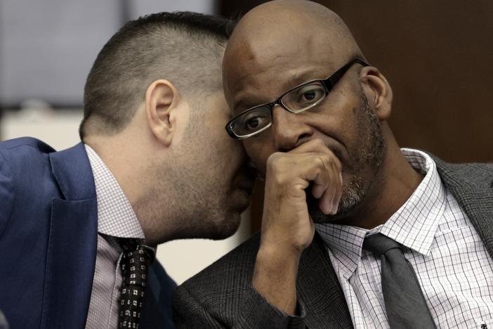 Christopher Dunn, right, listens to his attorney Justin Bonus during the first day of his hearing to decide whether to vacate his murder conviction in May at the Carnahan Courthouse in St. Louis. A Missouri judge on Monday overturned the conviction of Dunn, who has spent more than 30 years in prison for a killing he has long contended he didn’t commit.