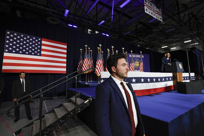 Members of the U.S. Secret Service stand watch as Vice President and Democratic Presidential candidate Kamala Harris speaks during her first campaign rally in Milwaukee, Wisconsin, on July 23, 2024. The assassination attempt on former president Donald Trump, the abrupt withdrawal of President Joe Biden from the race have added even more fuel to an active landscape of conspiracy theories about the 2024 campaign.