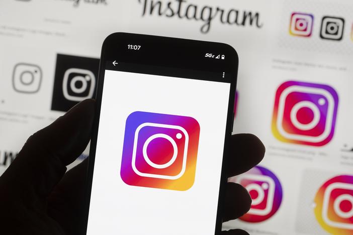 The Instagram logo is seen on a cellphone.