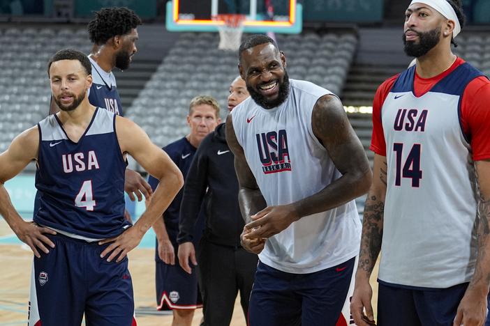 LeBron James, center, between Stephen Curry and Anthony Davis, attend practice before the start of the basketball competition at the 2024 Summer Olympics on Wednesday in Villeneuve-d'Ascq, France. 