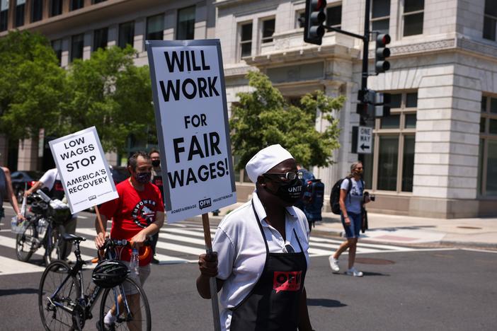 A protester participates in a “wage strike" demonstration on May 26, 2021, in Washington, D.C.