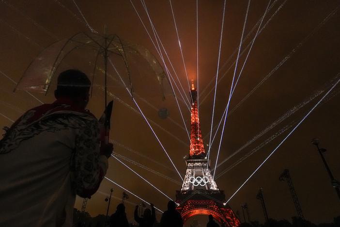 A light show is displayed on the Eiffel Tower during the opening ceremony of the 2024 Summer Olympics on Friday.