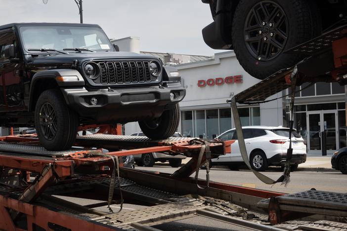 Jeeps are delivered to a dealership in Chicago on June 20. Stellantis, the parent company of Jeep, reported disappointing earnings for the first half of 2024. 
