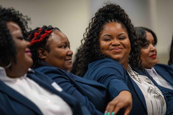 Bristeria Clark (center) at the graduation ceremony for Morehouse School of Medicine's first class of rural doulas, called perinatal patient navigators. Clark, who's also a nurse and county employee, wants other women to have more support than she did while navigating pregnancy, childbirth and postpartum care.