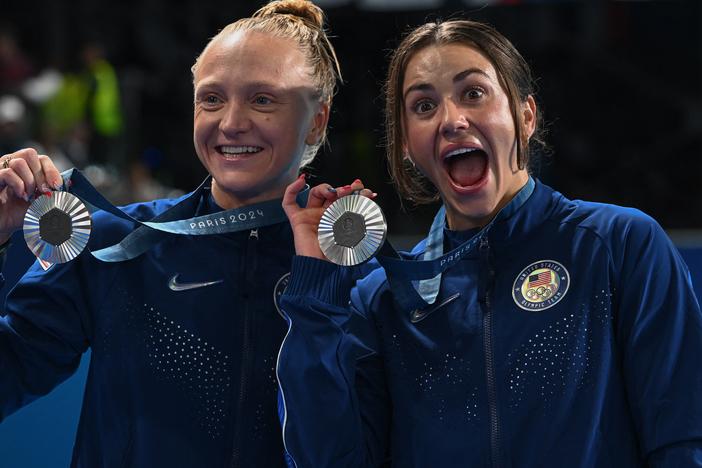 The United States won its first medals at the Paris Olympic Games when Kassidy Cook and Sarah Bacon took silver in the synchronized 3m springboard final on Saturday. Cook (right) and Bacon pose after the competition at the Aquatics Center in Saint-Denis, north of Paris.