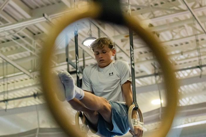 Hobie Biliouris, 14, of the Arlington Tigers gymnastics team practices on the rings at the Barcroft Sports & Fitness Center in Arlington, Va., on July 2. He recently joined the Tigers after his previous team ended its boys program.