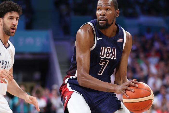 Kevin Durant of Team United States looks to pass against Serbia's Vasilije Micic (left) during the second half of Olympic group play at Stade Pierre Mauroy on Sunday in Lille, France.