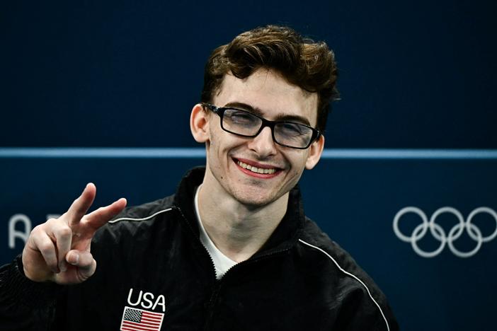 Stephen Nedoroscik throws a peace sign during the artistic gymnastics men's qualification at the Bercy Arena in Paris on Saturday.