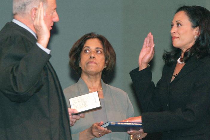 Harris takes the oath of office as San Francisco's district attorney on Jan. 8, 2004. Her mother, Dr. Shyamala Gopalan, holds a copy of "The Bill of Rights."