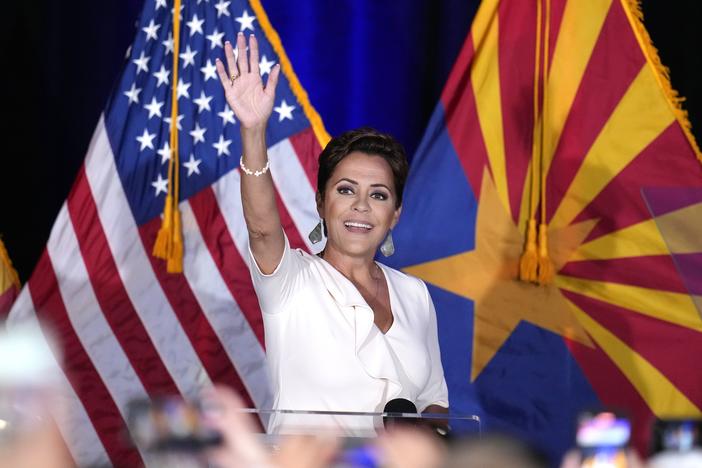 Republican Arizona Senate candidate Kari Lake waves to supporters as she arrives on stage after being declared her party's primary winner on Tuesday in Phoenix. 