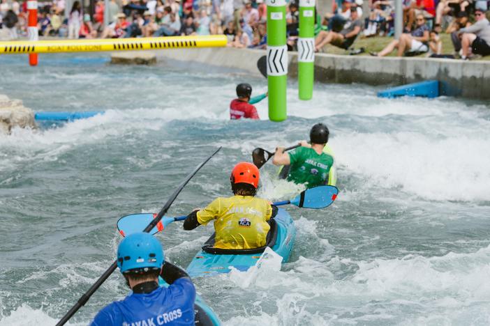 Competitors at the U.S. canoe and kayak cross slalom trials in Montgomery, Ala. float through the coarse in April 2024. 