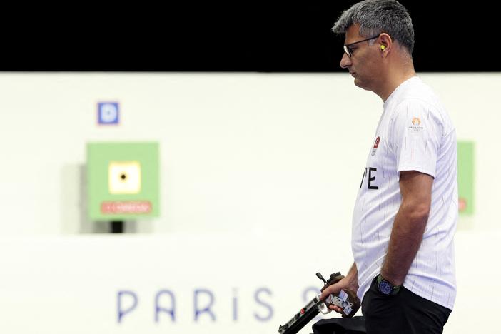 Turkey's Yusuf Dikec, pictured competing in the shooting 10m air pistol mixed team gold medal match at Chateauroux Shooting Center on Tuesday, went viral for his casual look. 