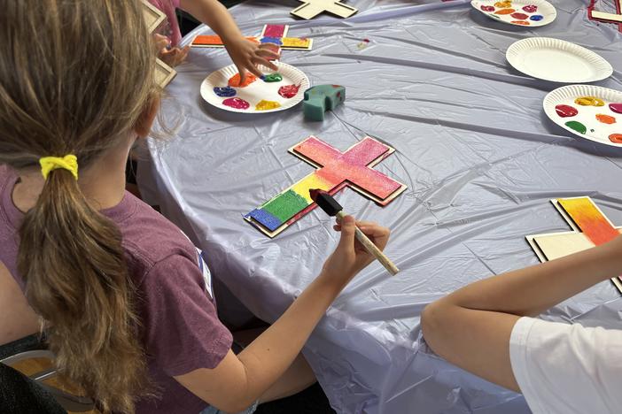 Campers at Mt. Olive Lutheran Church in Santa Monica, Calif., paint crosses during craft time at vacation Bible school.