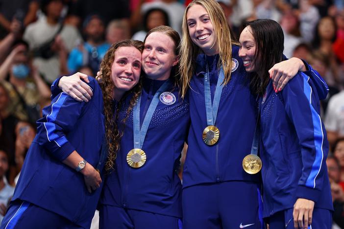 Gold Medalists (from left to right) Regan Smith, Lilly King, Gretchen Walsh and Torri Huske of Team United States celebrate on the podium during the medal ceremony after the Women’s 4x100m Medley Relay Final on Sunday at the Paris Olympics.